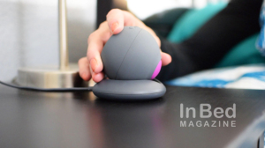 Setting the Revel Body Sonic Vibrator onto the stand.